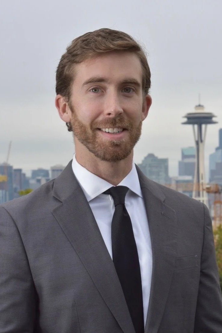Rob Gillette, mediator and arbitrator, photographed before the Seattle skyline